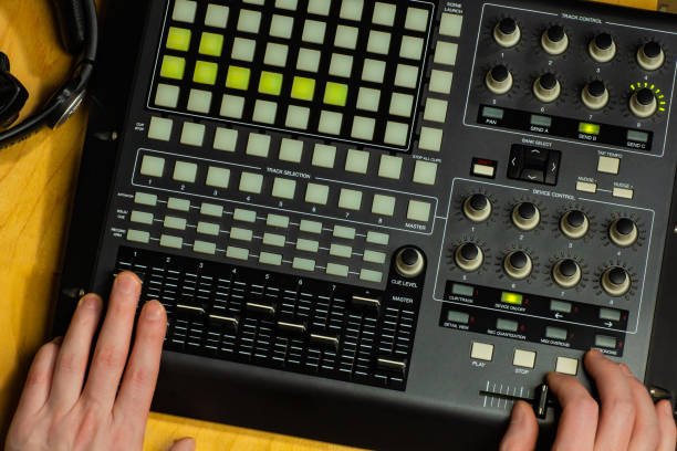 istock Music making with audio controller in sound recording studio 1392715649