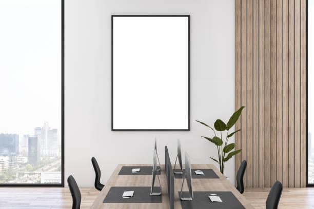 istock Modern wooden and concrete coworking office interior with empty mock up poster on wall, furniture, equipment, technology and window with city view. 3D Rendering. 1392715770
