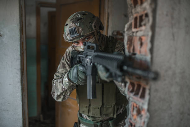 istock Special forces soldier in camouflage uniform fighting in conflict zone 1392716879
