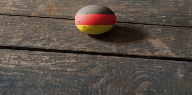 istock Flag of Germany on a painted egg on a wooden board. Easter in Ukraine. Painted eggs. Easter holiday 1392718930