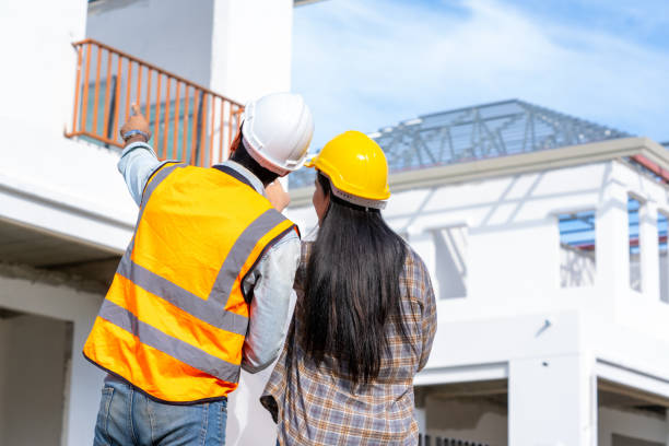 istock Engineer team work planning in construction site,Construction Contractors building a new home. 1392719988