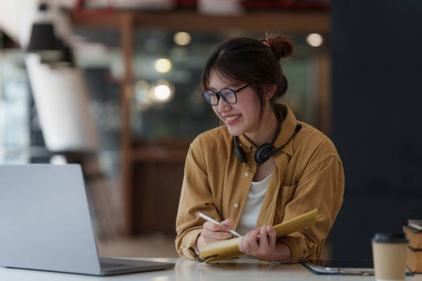 istock E-learning ,online ,education and internet social distancing protect from COVID-19 viruses concept. Asian woman student video conference e-learning with teacher on digital tablet at home. 1392721217