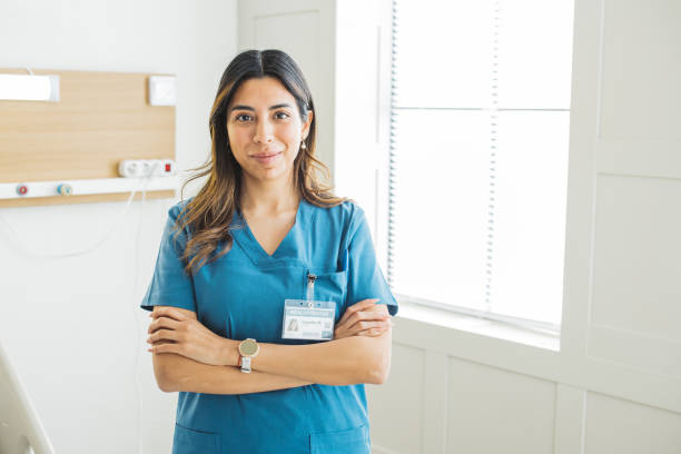 portrait of female nurse at medical clinic. - female nurse imagens e fotografias de stock