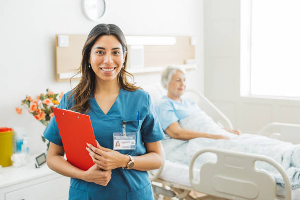 portrait of female nurse at medical clinic. - female nurse imagens e fotografias de stock