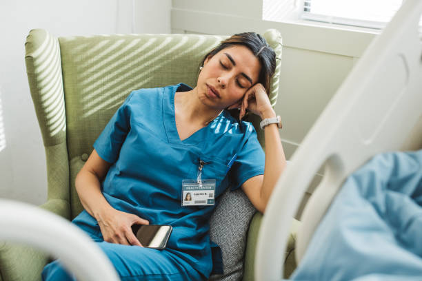 istock Tired nurse in hospital ward 1392721306
