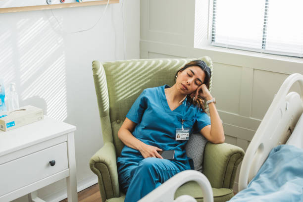 istock Tired nurse in hospital ward 1392721311