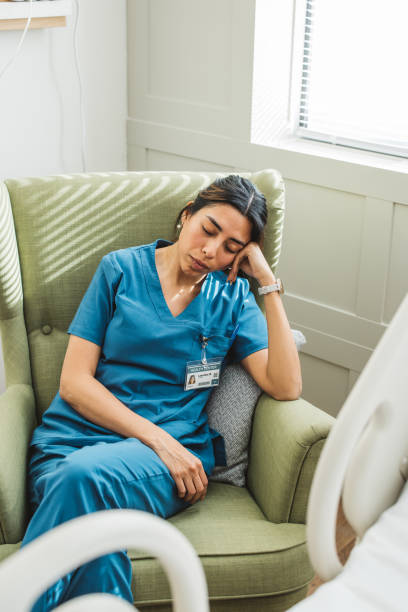 istock Tired nurse in hospital ward 1392721333