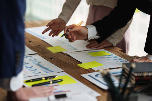 istock Business team hands at working with financial plan, meeting, discussion, brainstorm with tablet on office desk, Meeting concept. 1392721486