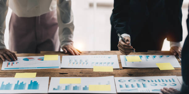 istock Business team hands at working with financial plan, meeting, discussion, brainstorm with tablet on office desk, Meeting concept. 1392721514