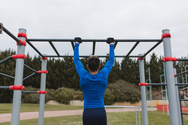 istock Young man practicing calisthenics outdoor. 1392721766