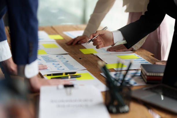 istock Business team hands at working with financial plan, meeting, discussion, brainstorm with tablet on office desk, Meeting concept. 1392721886