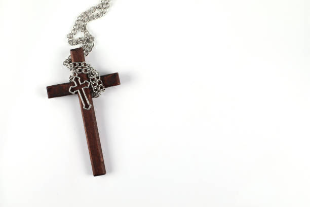 istock Wooden christian cross on white background with space to write. 1392727297