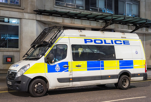 A British Transport Police van, with a front protective windscreen guard, parked on a street in central London.