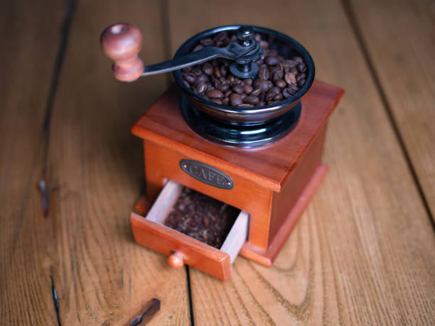 istock Old vintage grinder with roasted coffee beans and grind coffee 1392731377