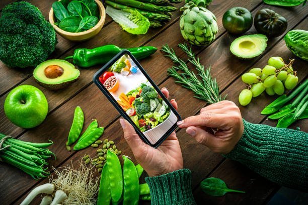 istock Looking online for healthy salad recipe 1392734068