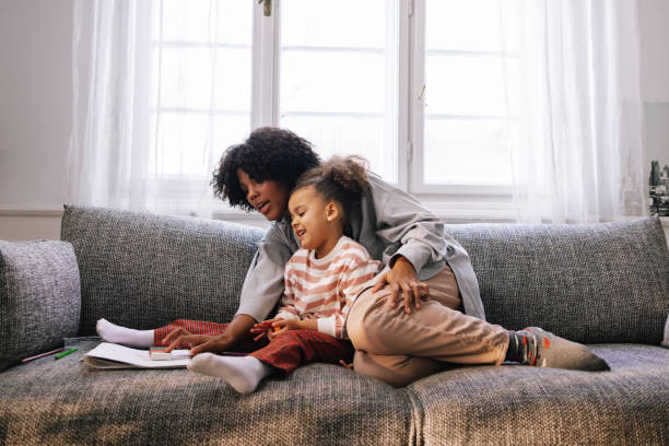 istock Mother Teaching Her Daughter Colours 1392735658