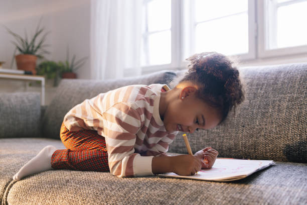 istock Little Girl Drawing 1392735660