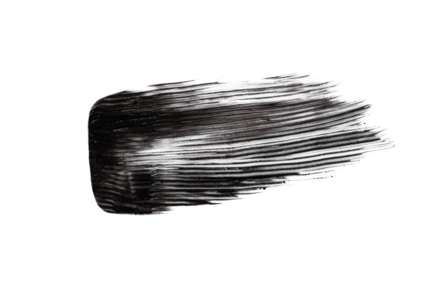 istock Black mascara brushstroke smear isolated on white background. 1392740128