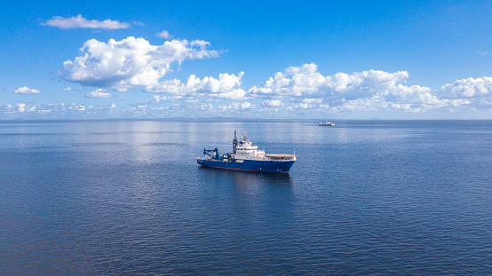 Offshore research and survey vessel Horizon Geobay at Anchor in Trinidad and Tobago. Offshore research and survey vessel Horizon Geobay aerial photo.