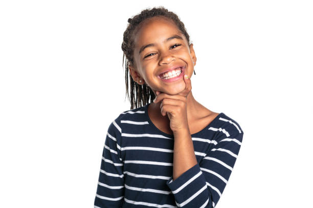 istock Adorable african little girl on studio white background thinking 1392743992