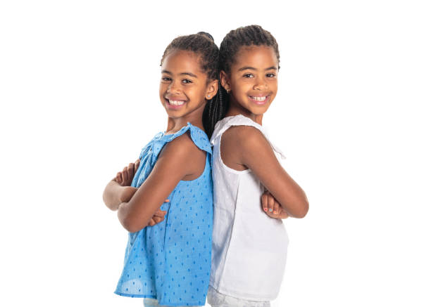 istock Two Adorable african twin girl on studio white background 1392744233