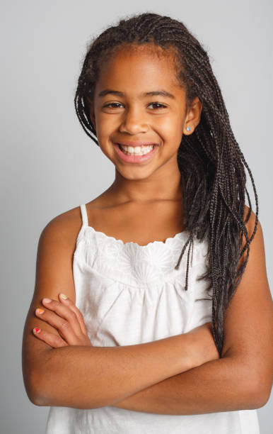istock Adorable african little girl on studio white background 1392744279