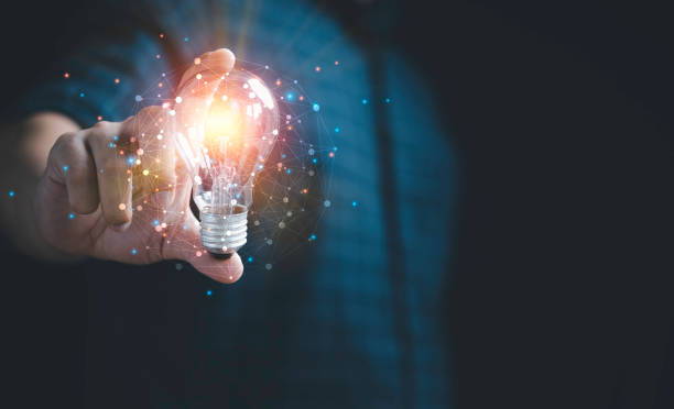 istock Businessman hand holding lightbulb with glowing light to creative smart thinking for inspiration and innovation with network concept. 1392746824