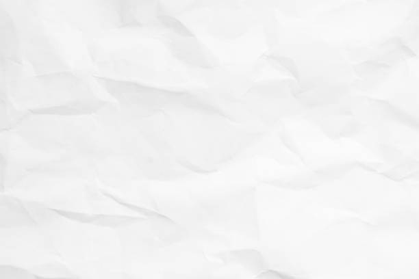 istock Grunge wrinkled white color blank paper textured background 1392747729