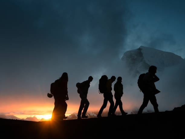 istock Group hiking together hiking together 1392747742