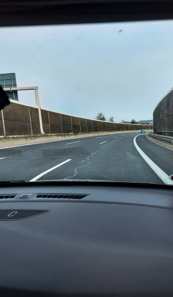 istock View from a moving car onto a highway with a noise barrier 1392748458
