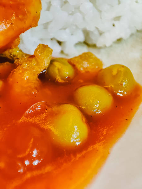 White rice with futunghai side dish on a white plate.