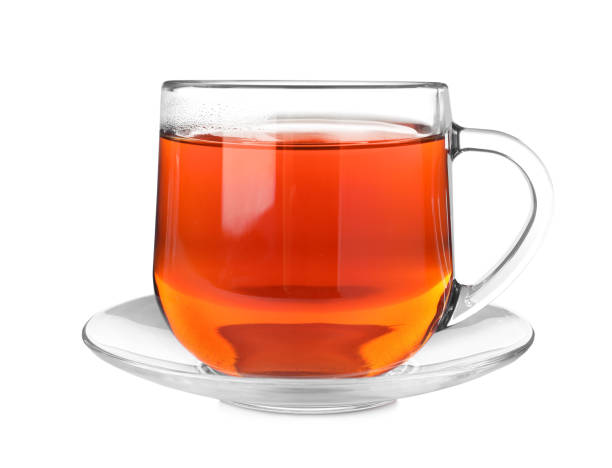 istock Glass cup of aromatic rooibos tea isolated on white 1392748505