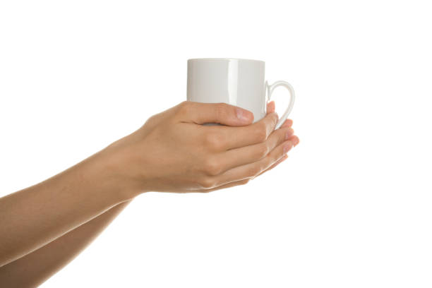 istock White cup in the female hands 1392748512