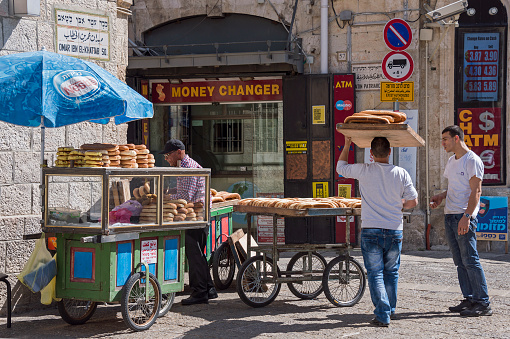 Jerusalem, Israel - May 03, 2015: Bread sellers near the Jaffa Gate in the historic center of the city