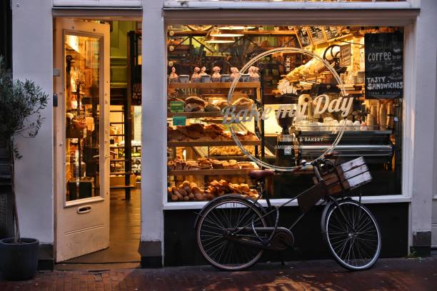 Assortment of freshly-made bread and desserts sitting on a display counter in an artisanal bakery and cafe