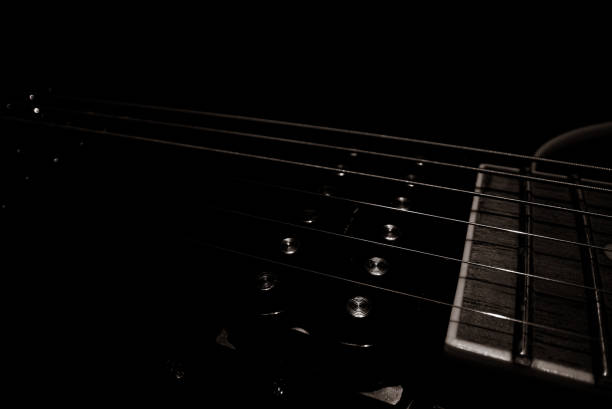 istock Close-up view of Six-string electric guitar pickup. 1392753493