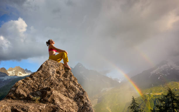 istock Young woman relaxing outdoors at sunset 1392753846