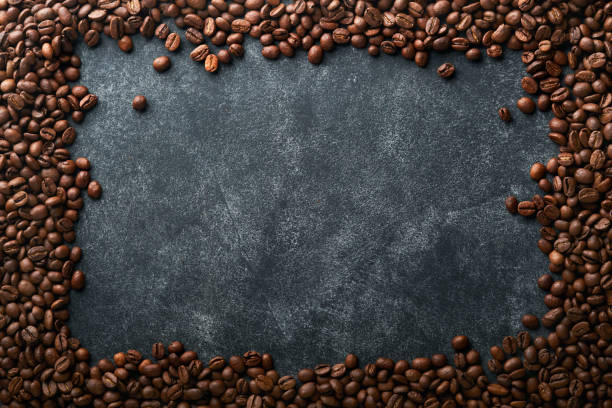 istock Coffee beans background. Roasted coffee beans. View from above. Coffee concept. Mock up. 1392755017