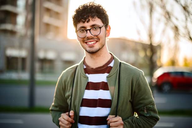 istock Smiling young man looking at the camera 1392757111