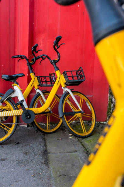 istock The yellow sharing bicycles against red wall, Chengdu, China 1392759878