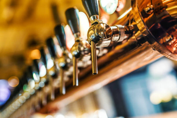 istock Beer taps for different types of drink. Bar interior 1392760009