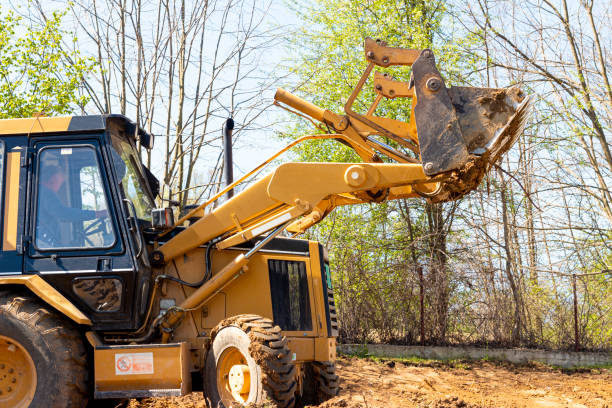 istock Excavator digs soil in village 1392763636