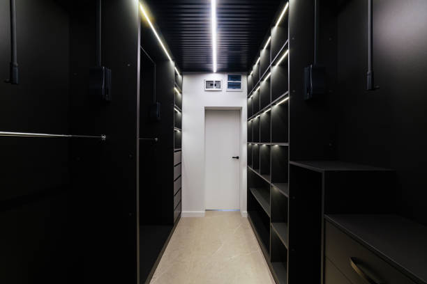 istock Lots of light for clothes in a black wardrobe 1392764734
