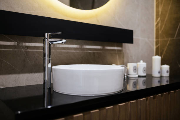 istock modern bathroom design with white sink metal faucet and backlight 1392764829