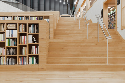 Modern Library Interior With Wooden Staircase And Bookshelves