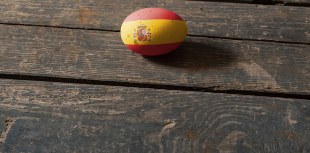 istock Flag of Spain on a painted egg on a wooden board. Easter in Spain. Painted eggs. Easter 1392767554