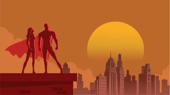 A retro art deco style illustration of a couple of superhero standing on a roof top with city skyline in the background. wide space available for your copy.