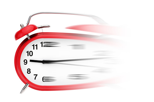 A time flies concept. Alarm clock with motion blur