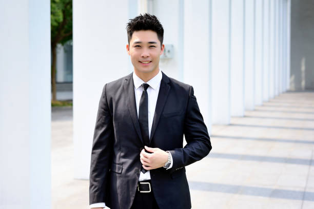 One asia men walking at outdoor aisle.