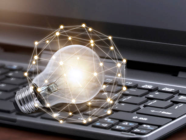 istock Laptop and glowing light bulb. Self learning or education knowledge and business studying concept. Idea of learning online or e-learning from home 1392772231